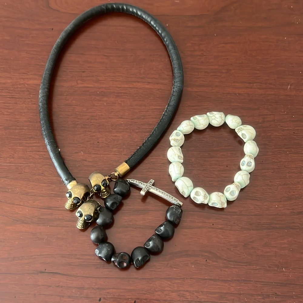Skull heads necklace and two skull head bracelets.